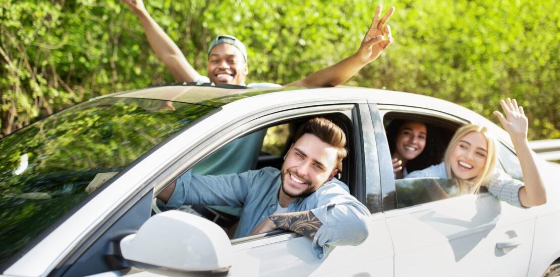 cheerful young diverse friends riding their car l 2025 03 18 18 44 26 utc scaled